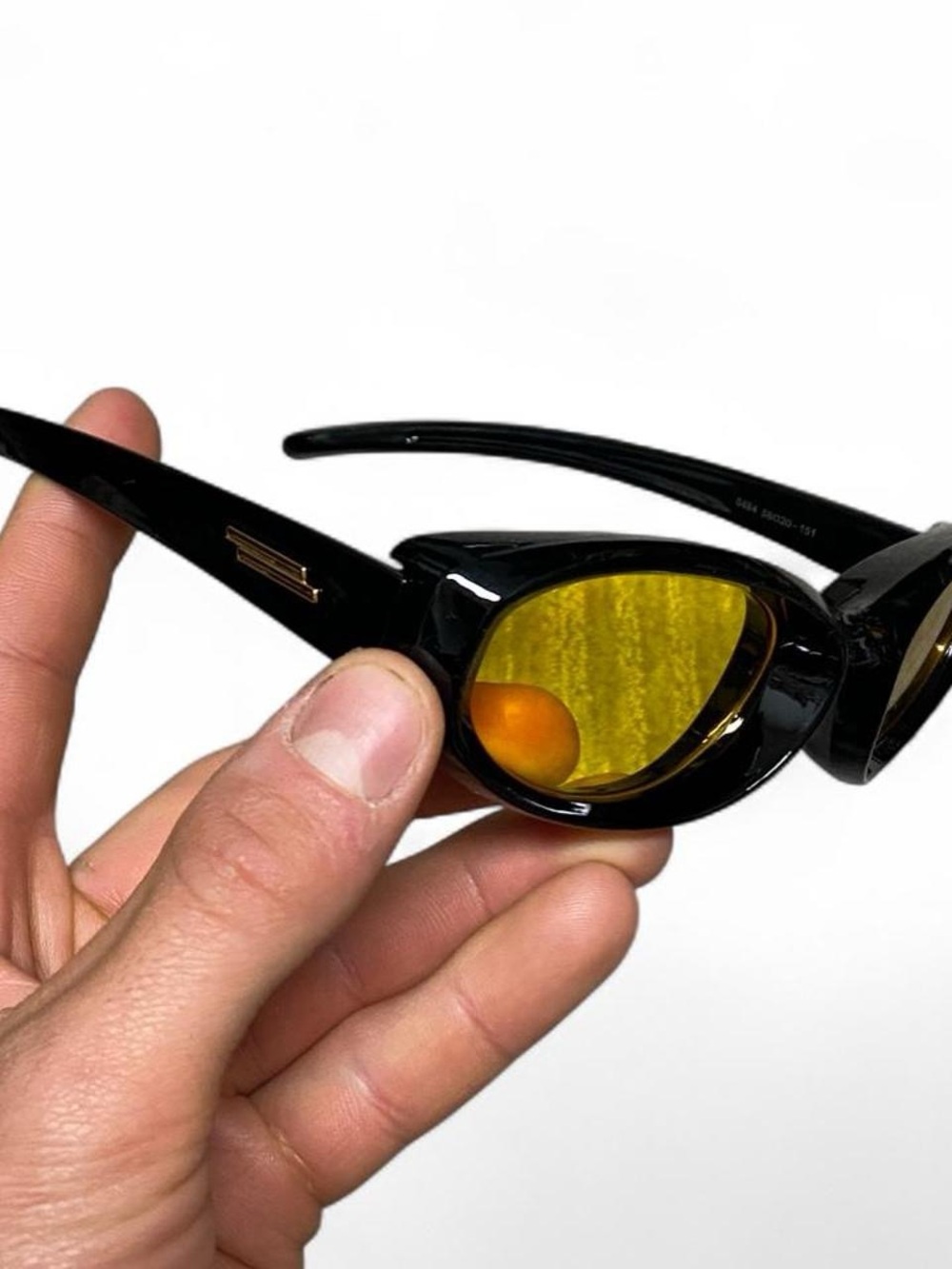 Black and yellow lens sunglasses